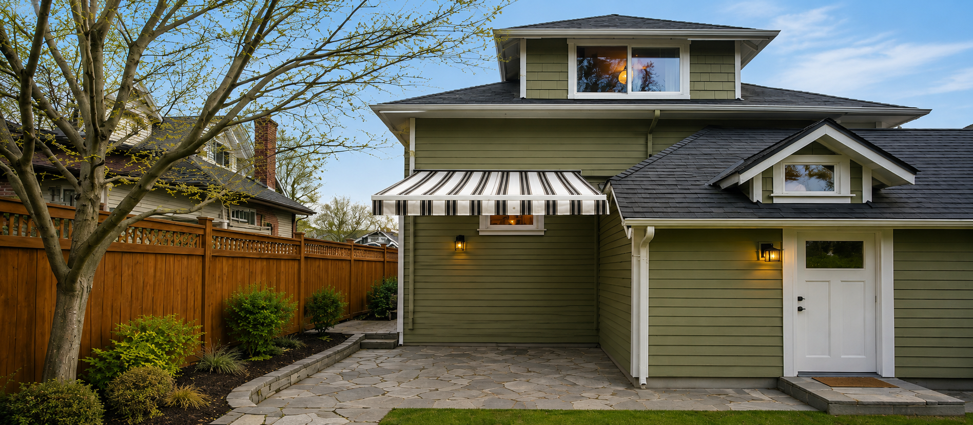 Rainier retractable awning over a narrow side-yard patio
