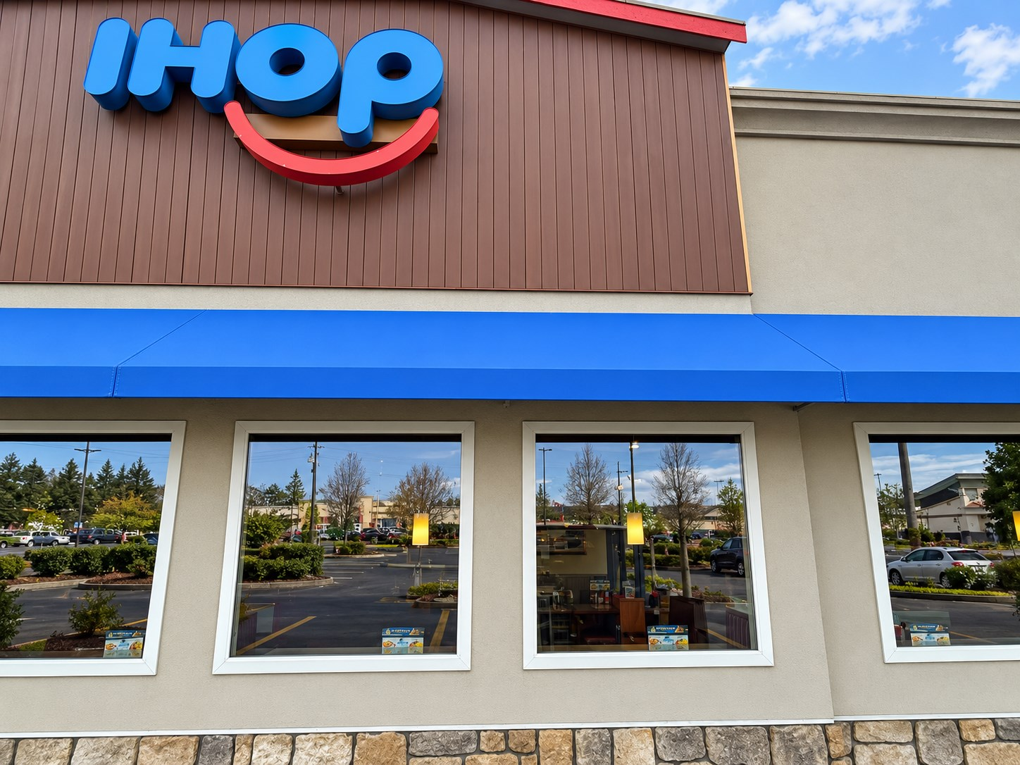 New blue awning fabric on the existing frames at a restaurant in Renton, WA