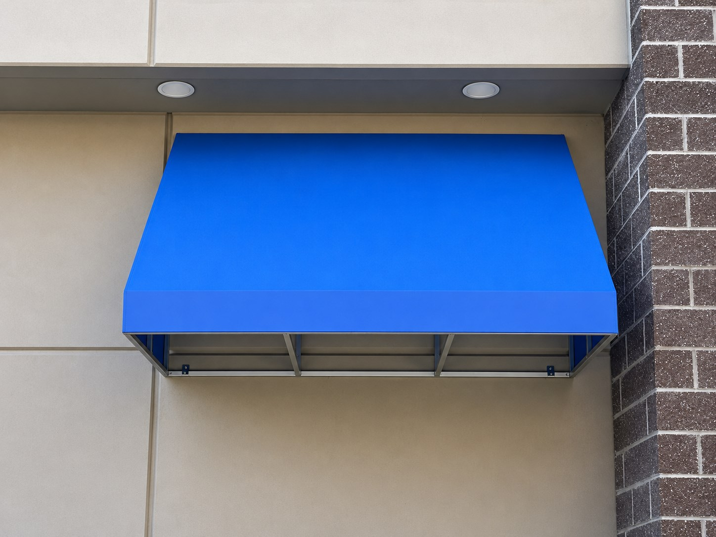 Recovered blue wedge awning at a business park in Kent, WA