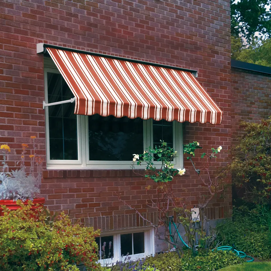 Red striped window awning shading a window