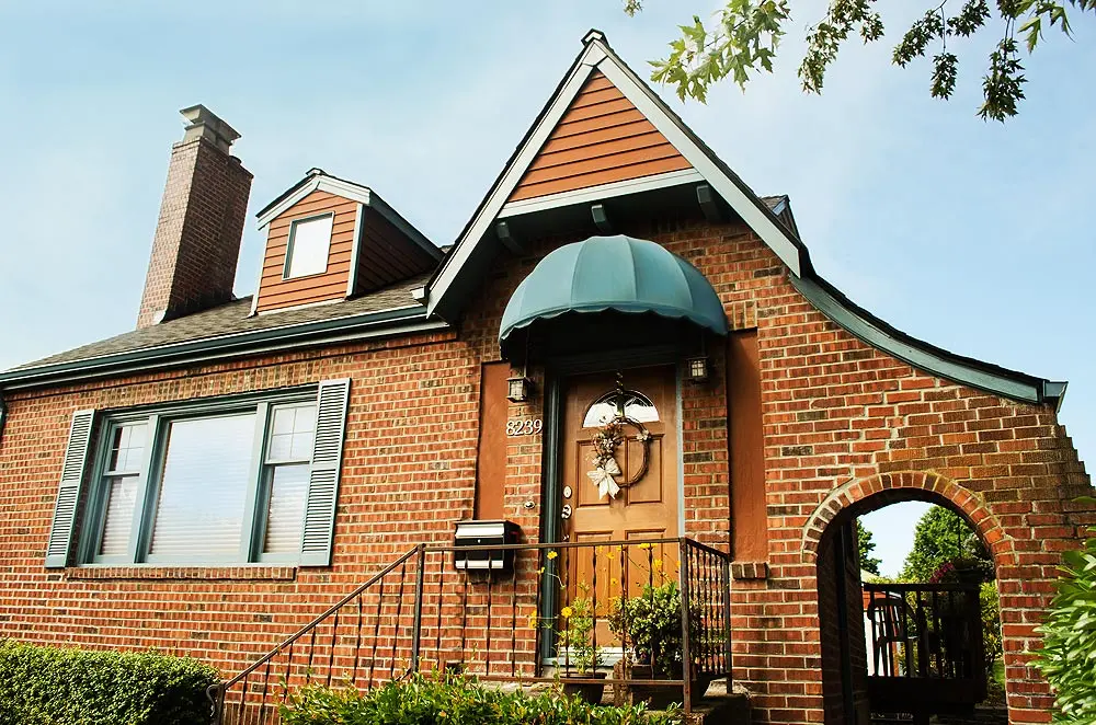 Fixed fabric awning over a front door