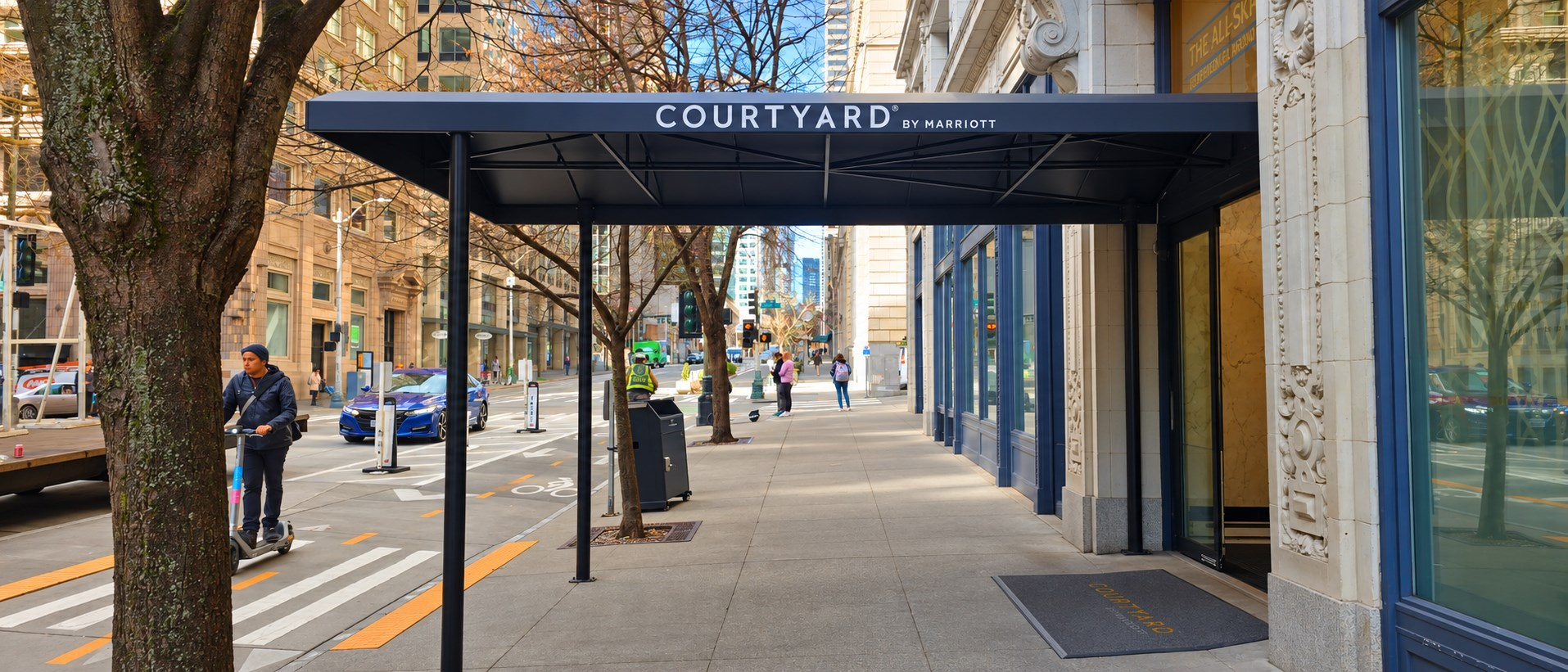 Recovered entry canopy with branded valance at a Seattle hotel