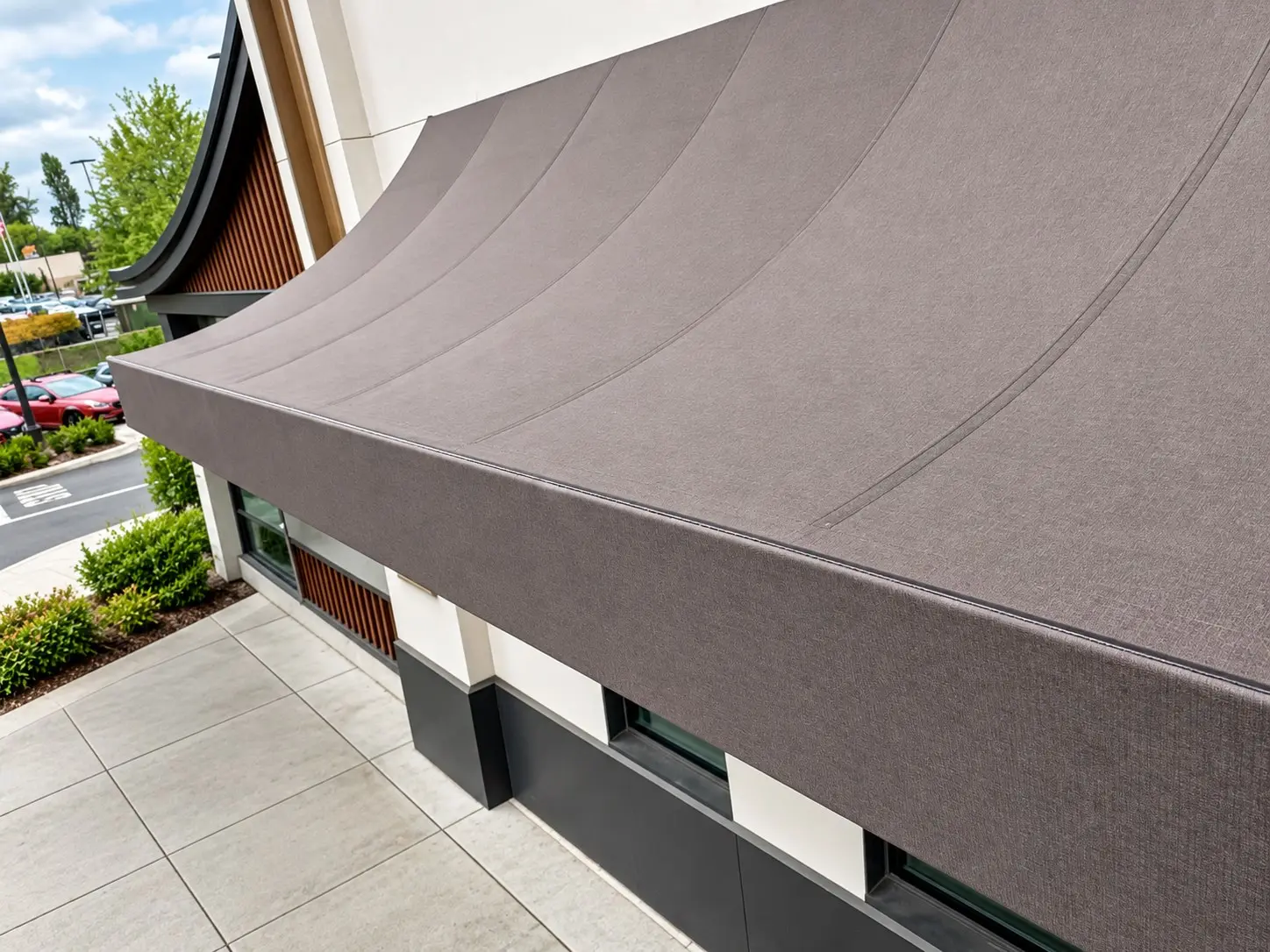 Large convex fabric awning on a shopping center storefront in Seattle