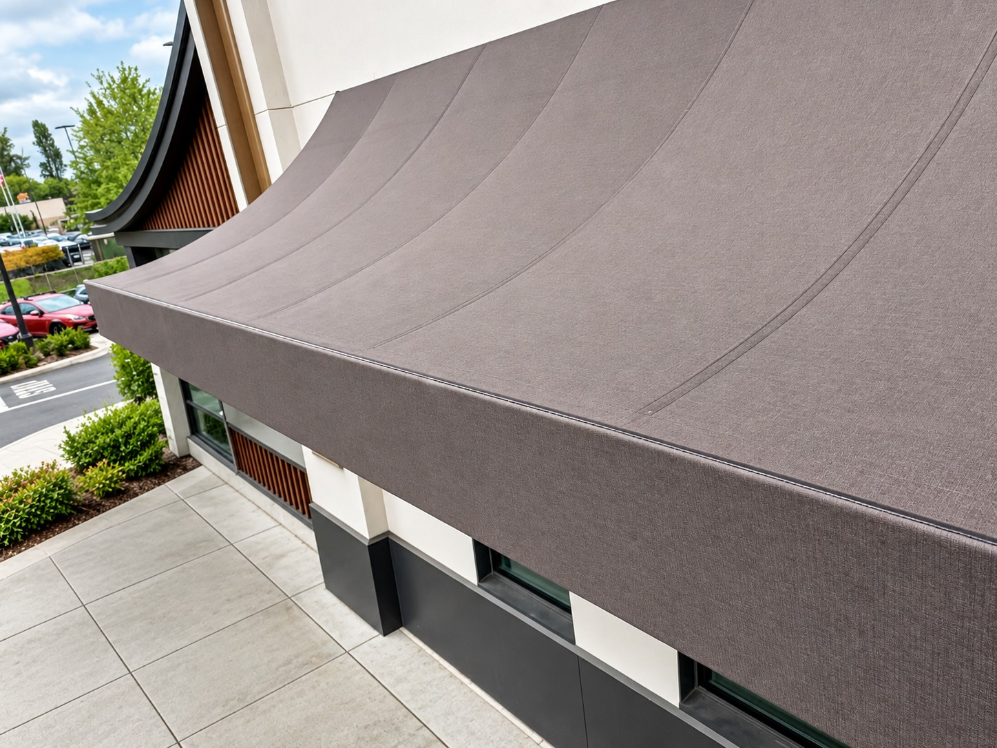 Large convex fabric awning on a shopping center storefront in Seattle