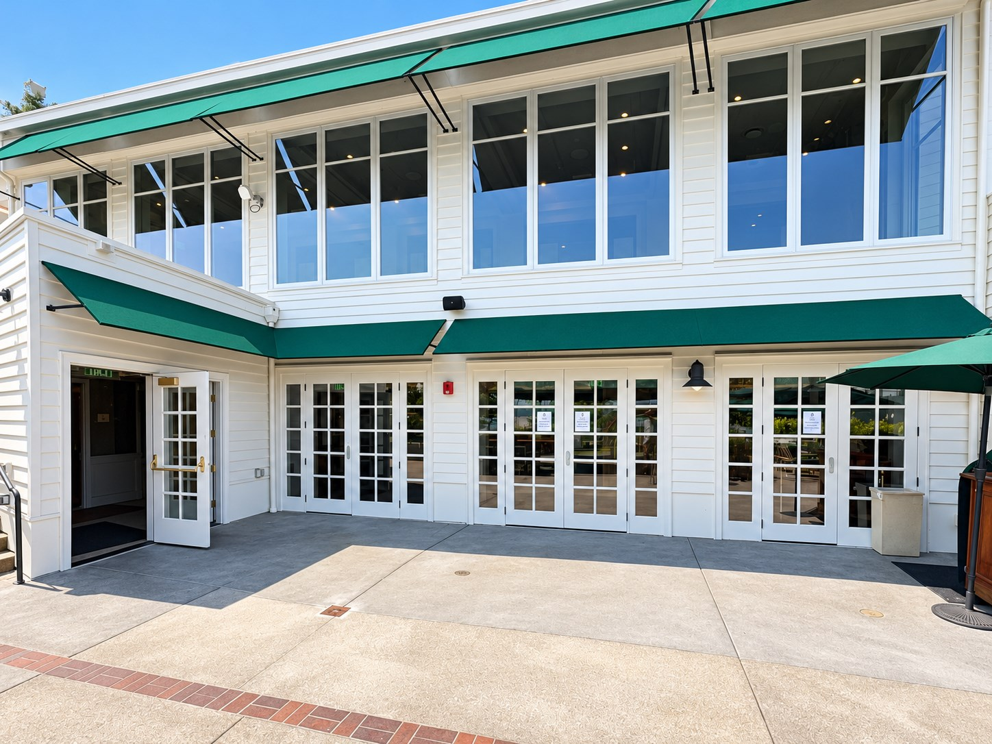 Commercial awnings on a private clubhouse in Seattle, designed and built by Rainier Shade